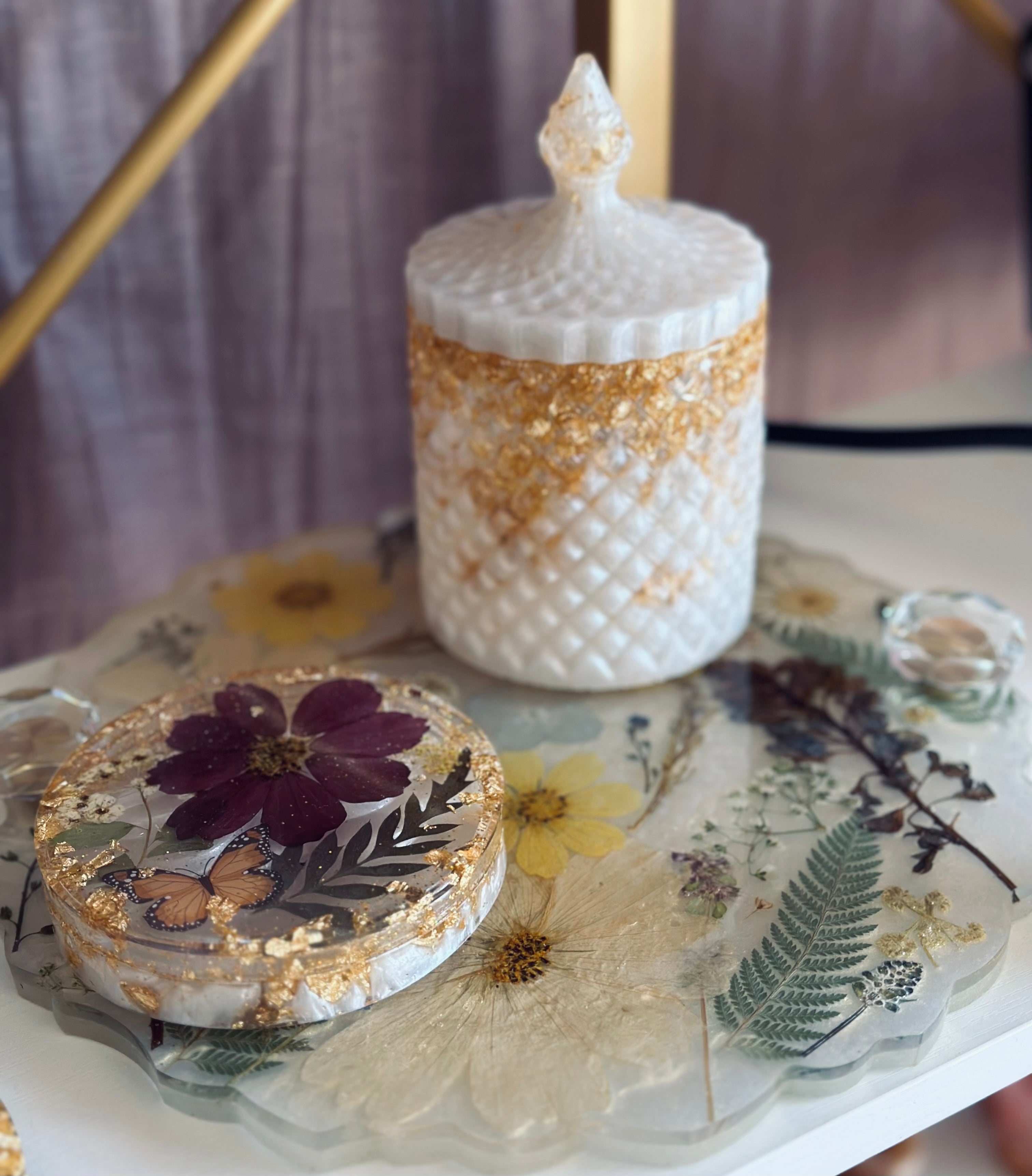 Decorative jar with lid on a floral tray